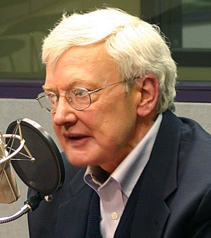 Roger Ebert speaking into a microphone.