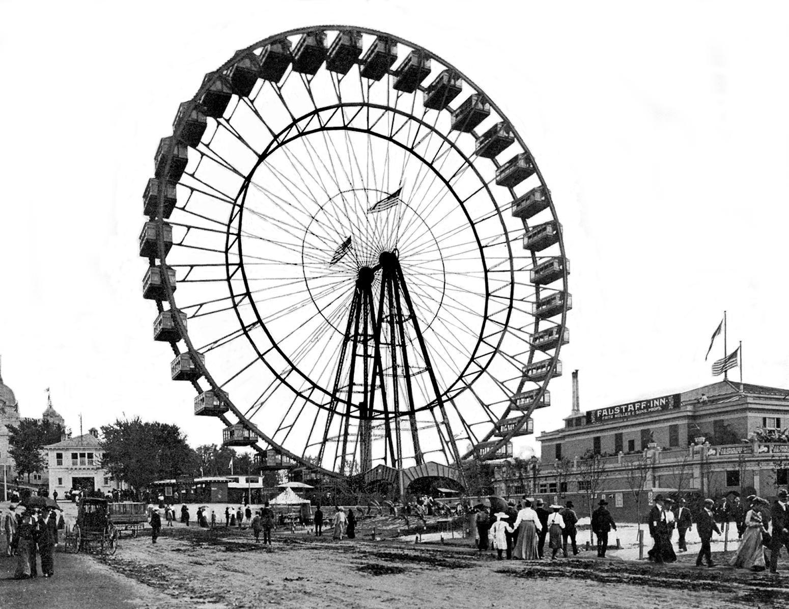 Dozens of people line up and gather around a tall Ferris wheel. 