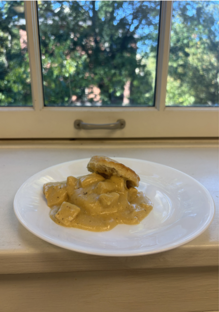 plate of creamed chicken over biscuits