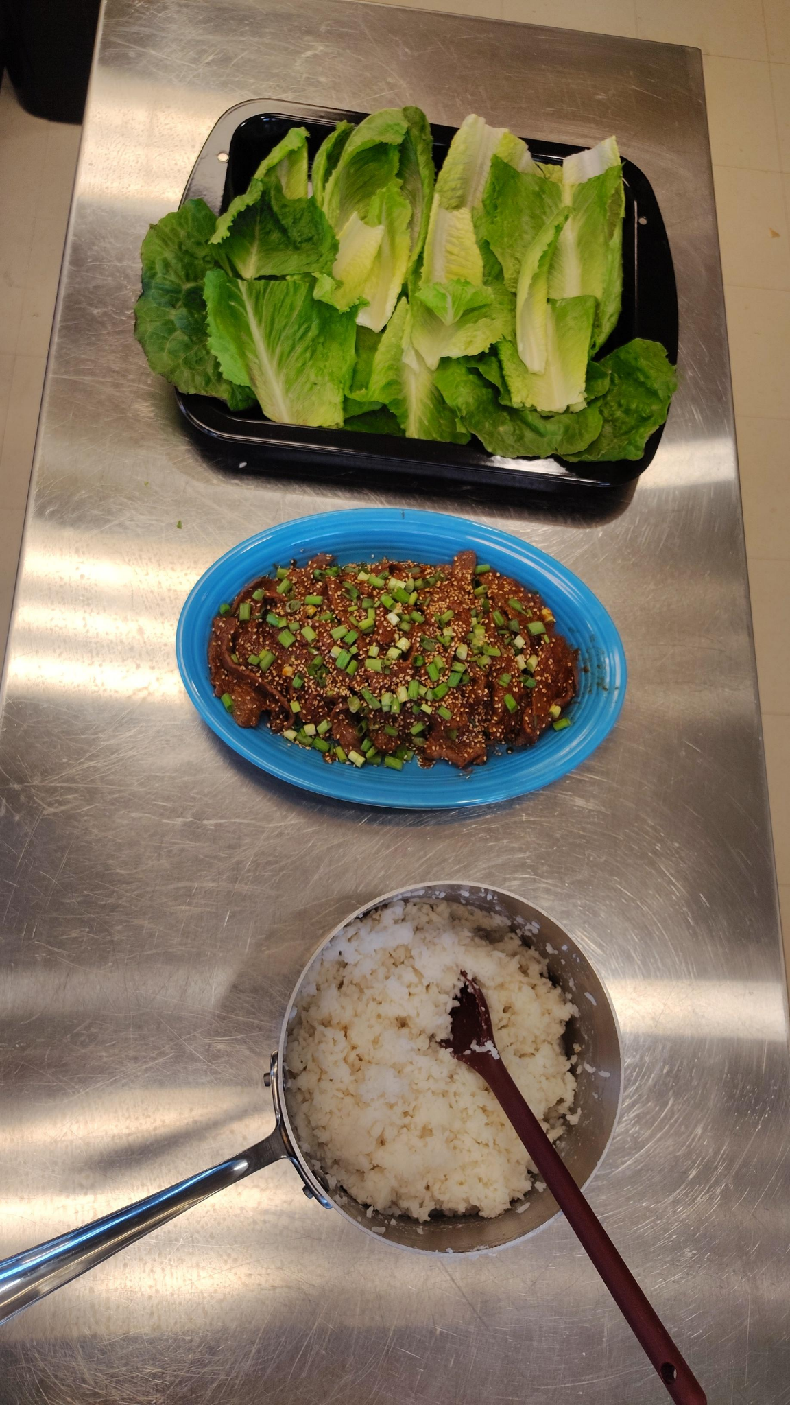 ingredients for lettuce wraps on the counter for serving