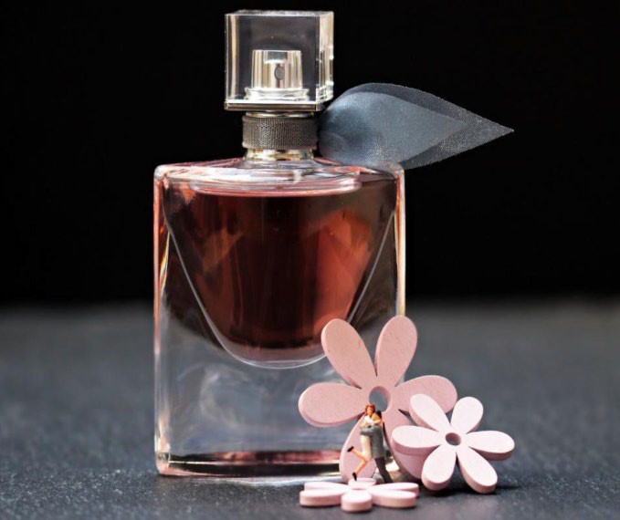 Picture of a perfume bottle with floral details.
