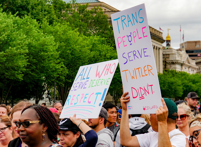 Individuals protesting the transgender military ban in the United States